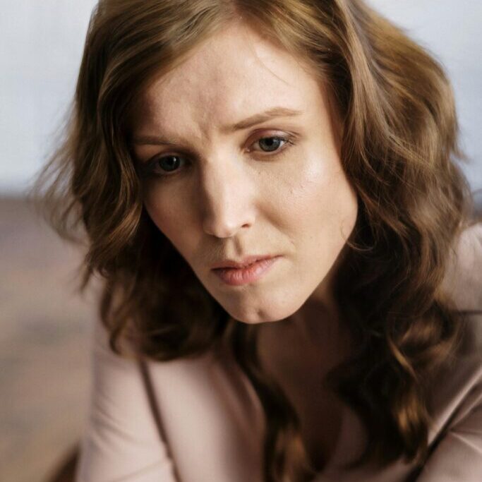 person in thinking deeply and looking intently at a spot during brainspotting